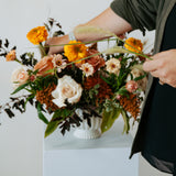 fall themed arrangement set on a white pedestal against a neutral backdrop for pick-up or delivery in central, ohio