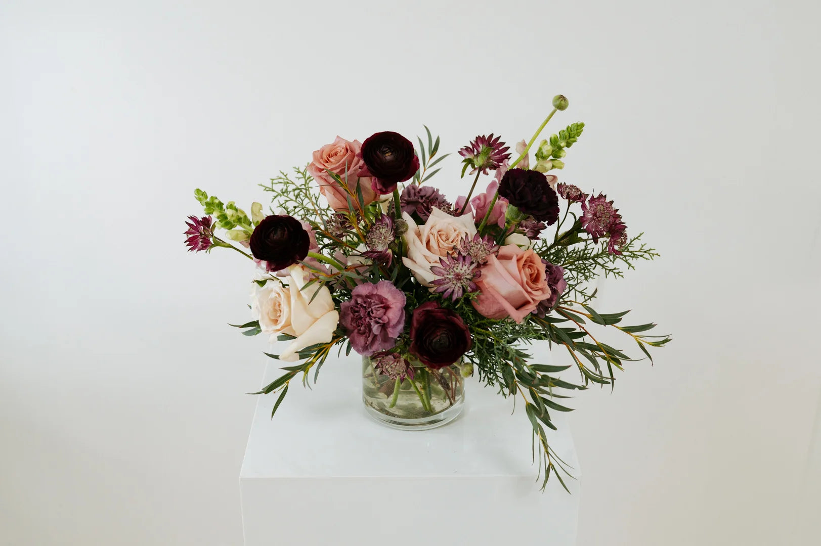 Bouquet of flowers in a clear vase on a white surface in Grandview, Ohio