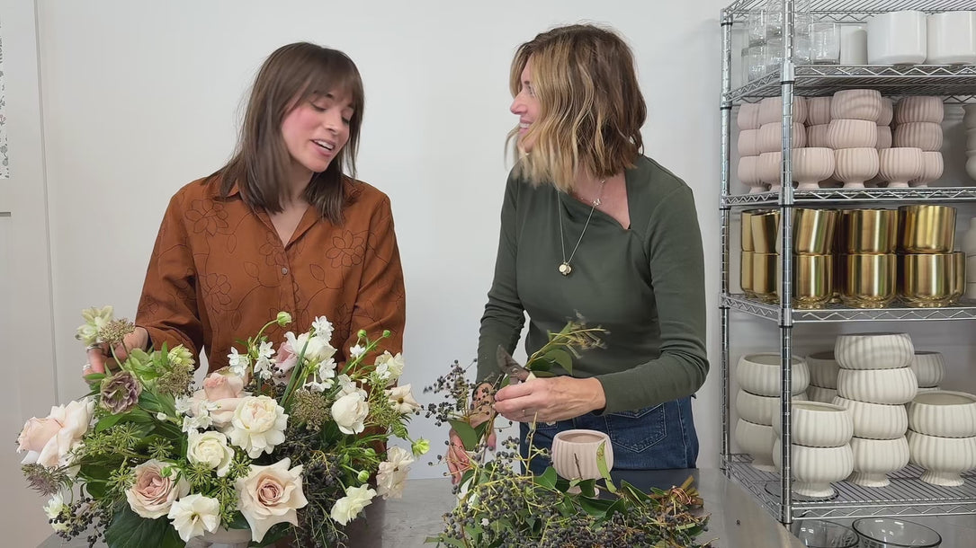 Flocal Co. employees putting together arrangements at their welcoming shop.