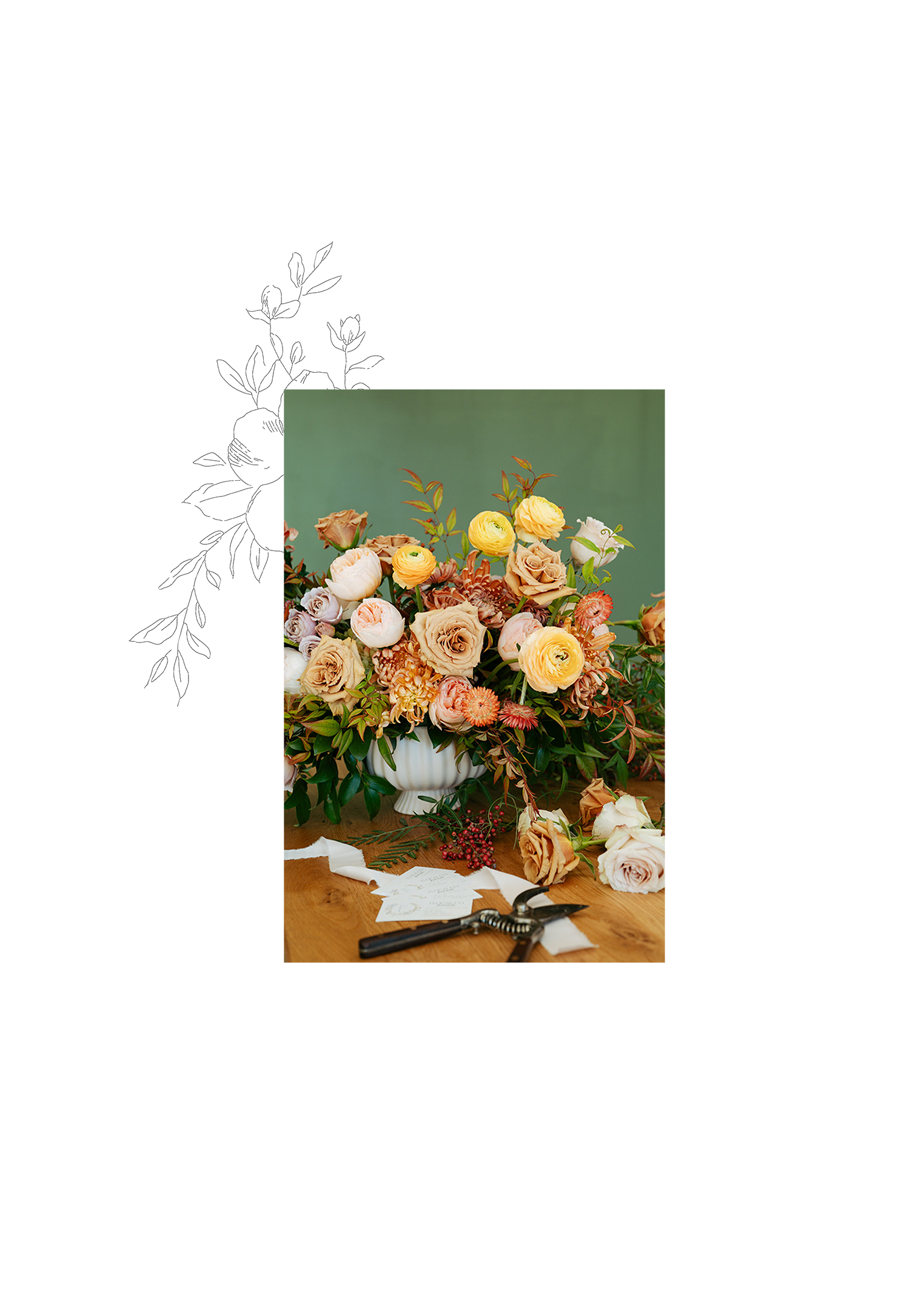 Floral arrangement on a wooden table with a white decorative element on a white background